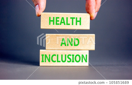 Health and inclusion symbol. Concept words Health and inclusion on wooden block. Beautiful grey table grey background. Doctor hand. Business motivational health and inclusion concept. Copy space. Health and inclusion symbol. Concept words Health and inclusion on wooden block. Beautiful grey table grey background. Doctor hand. Business motivational health and inclusion concept. Copy space. 105851689