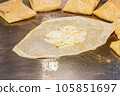 The process of making crepes crispy roti on a frying pan in a restaurant 105851697