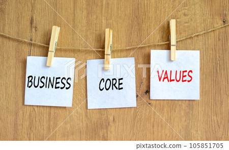 Business core values symbol. Concept words Business core values on beautiful white paper on clothespin. Beautiful wooden background. Business motivational business core values concept. Copy space. 105851705