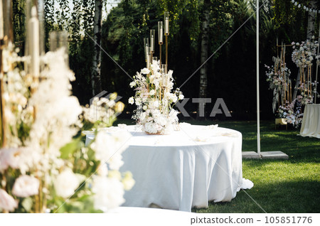 Wedding. Banquet. The chairs and round table for guests, served with cutlery. Wedding. Banquet. The chairs and round table for guests, served with cutlery. 105851776