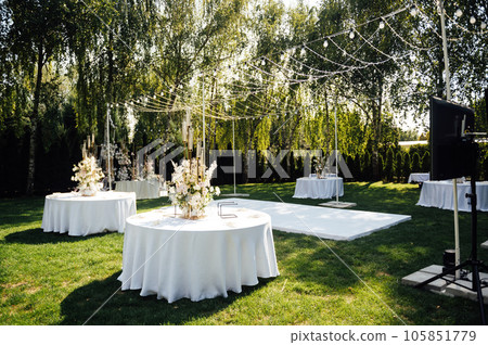 Wedding. Banquet. The chairs and round table for guests, served with cutlery. Wedding. Banquet. The chairs and round table for guests, served with cutlery. 105851779