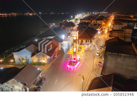 Aerial view of clock tower roundabout. Urban housing development from above. Top view. Real estate in Nakhon Phanom province city, Thailand. Property real estate at night. Aerial view of clock tower roundabout. Urban housing development from above. Top view. Real estate in Nakhon Phanom province city, Thailand. Property real estate at night. 105852348