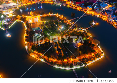 Aerial view of residential neighborhood roofs. Urban housing development from above. Top view. Real estate in Roi et province city, Thailand. Property real estate at night. 105852390