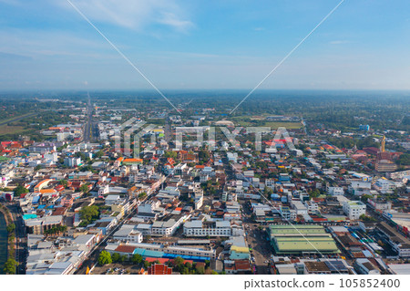 Aerial view of residential neighborhood roofs. Urban housing development from above. Top view. Real estate in Roi et province city, Thailand. Property real estate. 105852400