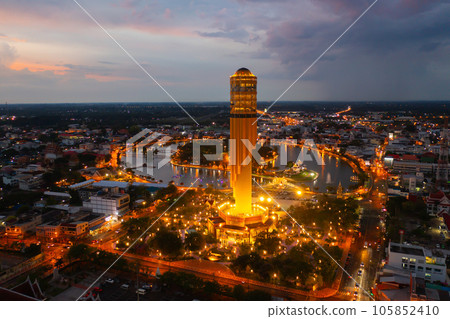 Aerial view of Roi Et tower, tourist attraction landmark. Urban housing development from above. Top view. Real estate in city, Thailand. Property real estate at night. 105852410
