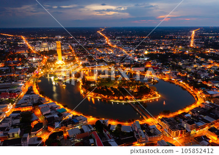 Aerial view of Roi Et tower, tourist attraction landmark. Urban housing development from above. Top view. Real estate in city, Thailand. Property real estate at night. 105852412