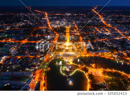 Aerial view of Roi Et tower, tourist attraction landmark. Urban housing development from above. Top view. Real estate in city, Thailand. Property real estate at night. 105852413