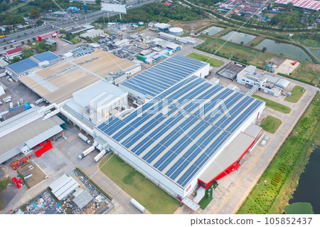 Aerial view of solar panels or solar cells on the roof of factory building rooftop. Power plant, renewable clean energy source. Eco technology for electric power in industry. 105852437