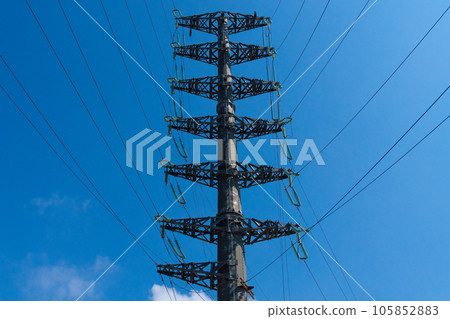 Construction site with new power poles on an overhead line Construction site with new power poles on an overhead line 105852883