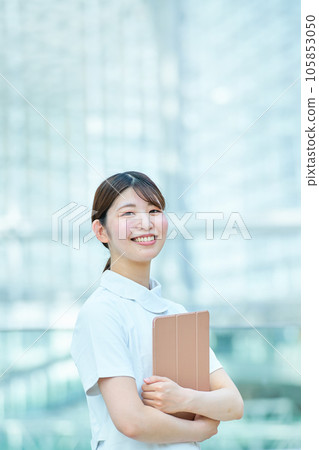 Portrait of a woman in white coat 105853050