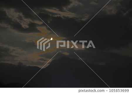 Hakushu-cho, Hokuto City, Above Kaikoma, the first quarter moon appears between clouds in July 8.4 Hakushu-cho, Hokuto City, Above Kaikoma, the first quarter moon appears between clouds in July 8.4 105853699