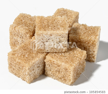 Cane sugar cubes on white background Cane sugar cubes on white background 105854583