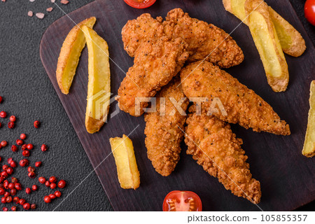 Delicious crispy chicken nuggets breaded with salt and spices 105855357