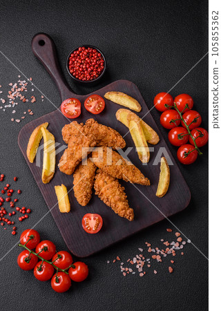 Delicious crispy chicken nuggets breaded with salt and spices 105855362
