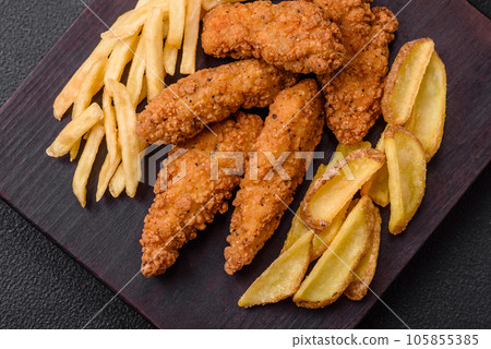 Delicious crispy chicken nuggets breaded with salt and spices Delicious crispy chicken nuggets breaded with salt and spices 105855385