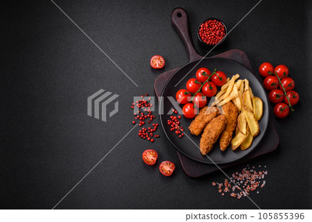 Delicious crispy chicken nuggets breaded with salt and spices 105855396