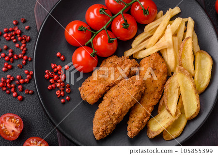 Delicious crispy chicken nuggets breaded with salt and spices 105855399