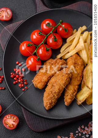 Delicious crispy chicken nuggets breaded with salt and spices Delicious crispy chicken nuggets breaded with salt and spices 105855400
