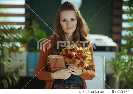 40 years old business owner woman in green office 40 years old business owner woman in green office 105855975