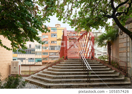 Bridge in Girona, Catalonia, Spain: Eiffel Bridge constructed by Gustave Eiffel over the Onyar River in Girona, Catalonia, Spain. 105857426