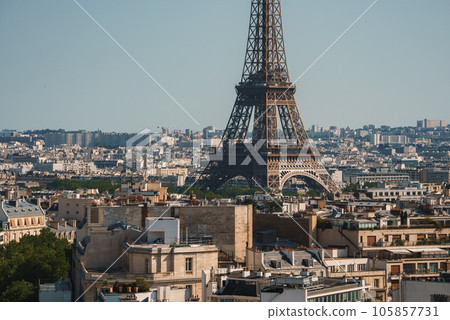 Daytime photo of the Eiffel Tower under a clear blue sky in Paris, France. Daytime photo of the Eiffel Tower under a clear blue sky in Paris, France. 105857731