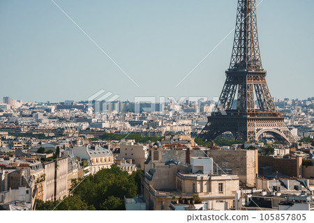 Daytime photo of the Eiffel Tower in Paris, France under a clear blue sky. Daytime photo of the Eiffel Tower in Paris, France under a clear blue sky. 105857805