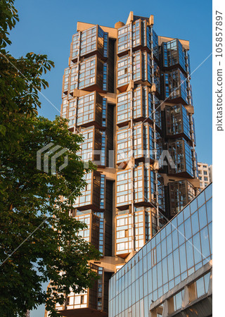 Modern high-rise building with 20 floors, surrounded by greenery in San Francisco. Modern high-rise building with 20 floors, surrounded by greenery in San Francisco. 105857897