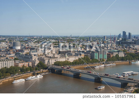Aerial shot of vehicles moving on waterloo bridge. Beautiful view of river Thames during sunny day. Cityscape under clear blue sky. 105857961