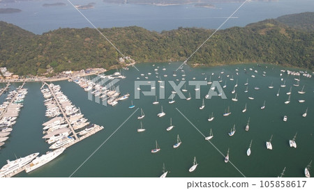 drone point of view of typhoon shelter which park full of yachts in sai kung 105858617