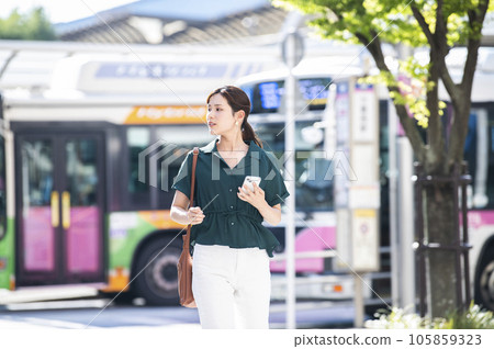 Young woman walking in bus terminal 105859323