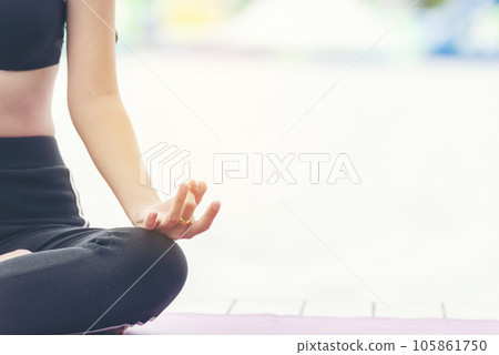 Yoga fitness lifestyle healthy woman relaxation doing a meditation. Yoga meditate outdoor with zen on sitting position. Yoga woman workout in sportswear sit on yoga mat home fitness workout exercise 105861750