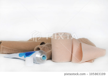 topical medication with roll bandage for first aid accident  105863109