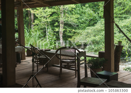 Riverside terrace and chairs and relaxation. Riverside terrace and chairs and relaxation. 105863300