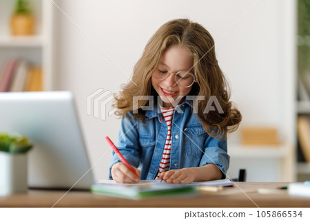 Girl doing homework or online education. 105866534