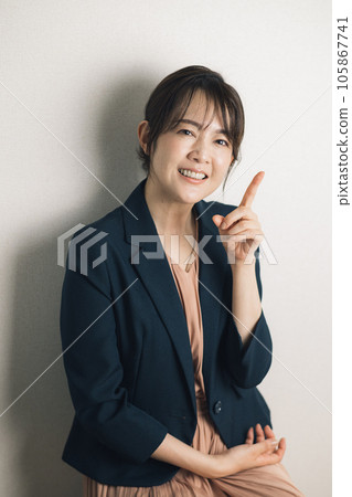 A woman in a suit, a career woman A woman in a suit, a career woman 105867741