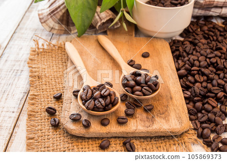 Coffee beans on wooden background 105869373