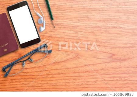 Office desk with smart phone,glasses,passport tow view Office desk with smart phone,glasses,passport tow view 105869983