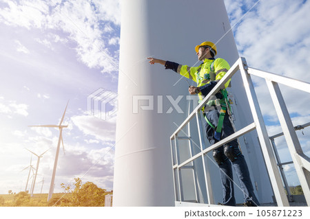 Wind turbine technician checking service. Engineer team professional working maintenance clean power generator system Wind turbine technician checking service. Engineer team professional working maintenance clean power generator system 105871223