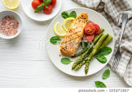 Baked Delicious salmon, green asparagus on  plate 105871867