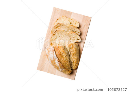 Freshly baked bread slices on cutting board isolated on white background . top view Sliced bread Freshly baked bread slices on cutting board isolated on white background . top view Sliced bread 105872527