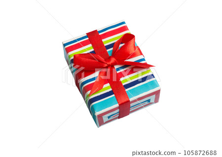 Wrapped christmas or other holiday handmade present in paper with colored ribbon. Present box, decoration of gift on table, top view with copy space Wrapped christmas or other holiday handmade present in paper with colored ribbon. Present box, decoration of gift on table, top view with copy space 105872688