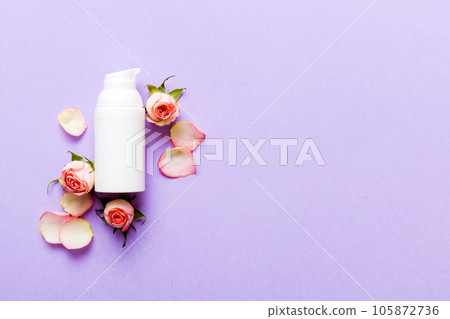 Fancy healthcare bottles for cream with rose flower. Natural oranic spa cosmetics concept. Mockup, template, Top view Fancy healthcare bottles for cream with rose flower. Natural oranic spa cosmetics concept. Mockup, template, Top view 105872736
