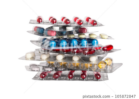 too many different pill cartridges stacked. selective Focus. Packs of blister pills with tablets. Colored pastilles packages. A pile of medicine in blister packs. Pharmaceutical blister packs 105872847