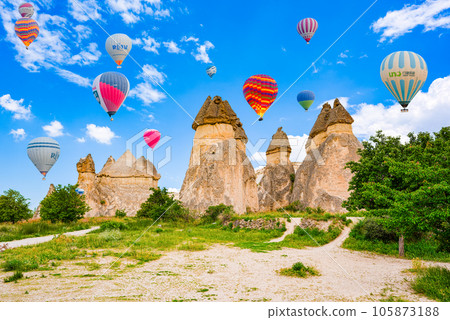 Cappadocia, Turkiye - July 07, 2023-Air balloons place in Cappadocia-Fairy Chimneys . Cappadocia, Turkiye - July 07, 2023-Air balloons place in Cappadocia-Fairy Chimneys . 105873188