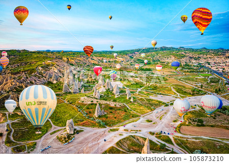 Cappadocia, Turkiye - July 07, 2023-Air balloons in Cappadocia-unreal views in valley. 105873210