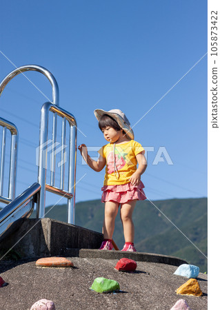 Children playing on the slide Children playing on the slide 105873422