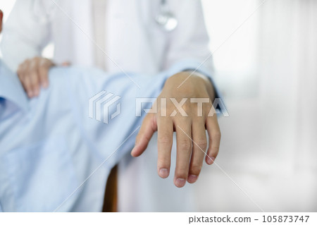 Female physiotherapists provide physical assistance to male patients with shoulder injuries massage their shoulders for muscle recovery in the rehabilitation center. Physiotherapy concepts Female physiotherapists provide physical assistance to male patients with shoulder injuries massage their shoulders for muscle recovery in the rehabilitation center. Physiotherapy concepts 105873747
