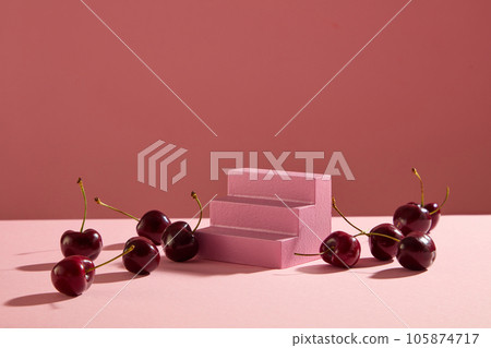Minimal scene of pink staircase with blank space decorated with some cherries. Cherries are loaded with benefits to your body Minimal scene of pink staircase with blank space decorated with some cherries. Cherries are loaded with benefits to your body 105874717