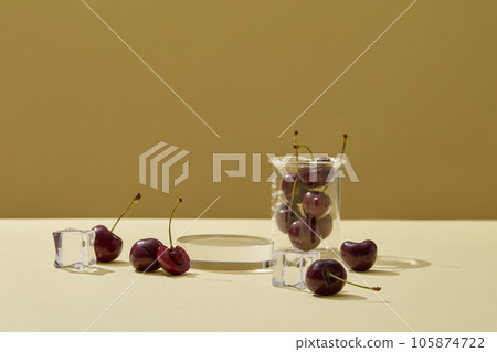 A beaker containing many cherries displayed with ices and a round-shaped podium. Vacant space to display your product that extracted from Cherry A beaker containing many cherries displayed with ices and a round-shaped podium. Vacant space to display your product that extracted from Cherry 105874722