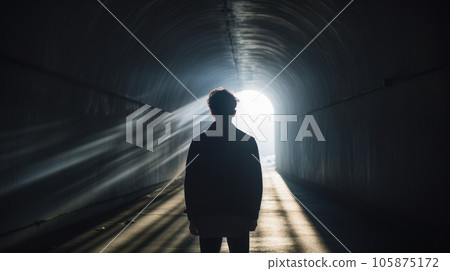 Light Piercing Darkness Description, A person standing in a tunnel with sunlight streaming through the exit Light Piercing Darkness Description, A person standing in a tunnel with sunlight streaming through the exit 105875172